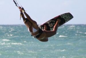 a person riding a kiteboard in the air