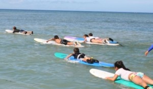 a group of people swimming in the ocean