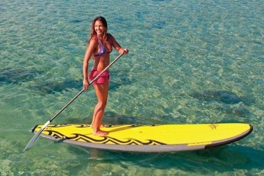 a person riding a surf board on a body of water