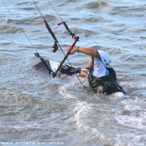 a man riding a board on a body of water