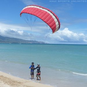 a man flying a kite on the beach