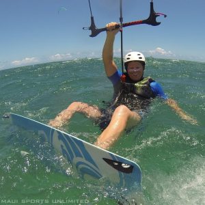 a man riding a wave on a surf board on a body of water