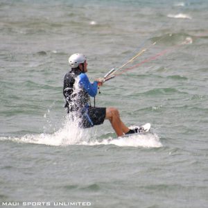 a man riding on top of a body of water